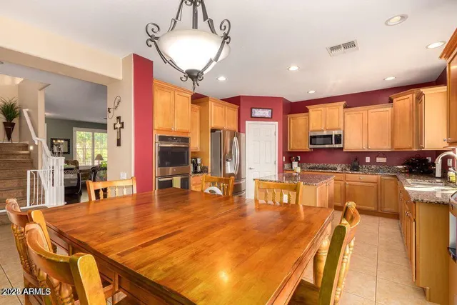 a room with lots of table and chairs