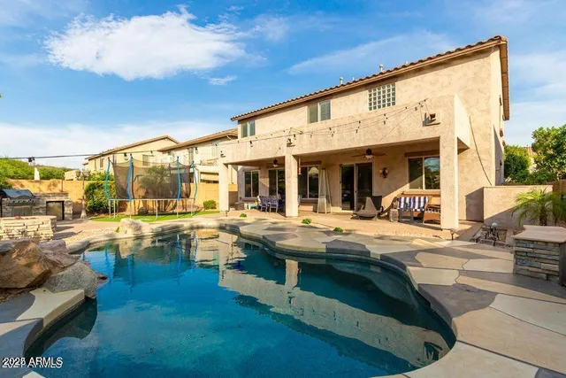 a view of a patio with couches and dinning table and chairs in patio