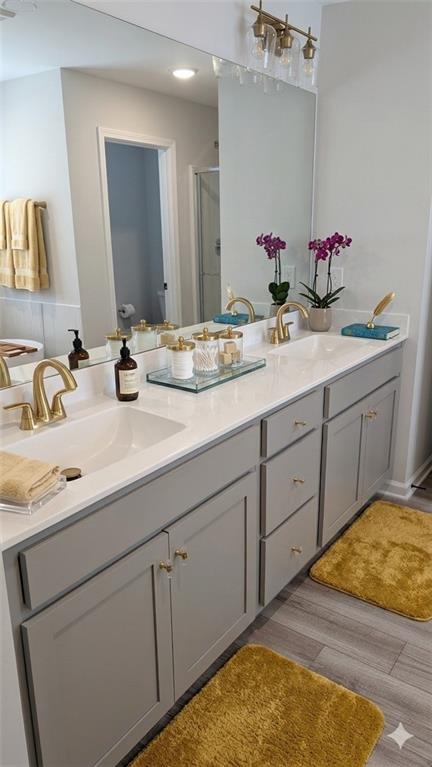 4830 Spangle Court Cumming, GA 30028 - Photo 11 of 18 a bathroom with a sink and a mirror