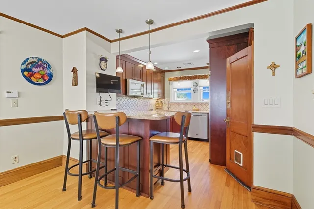 a view of a dining room with furniture and a wooden floor