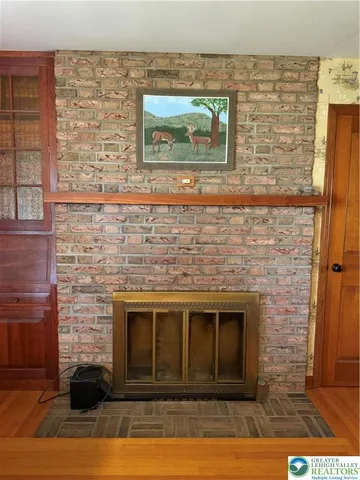 a view of a brick house with a yard