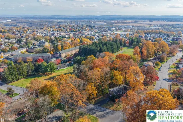 a kitchen with stainless steel appliances kitchen island granite countertop a stove and a sink