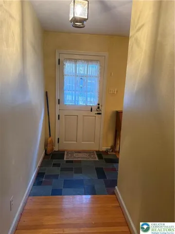 a view of a fireplace with wooden floor