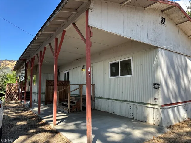 a view of a house with wooden stairs