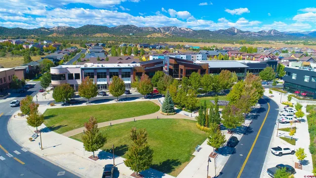 a view of a swimming pool with an outdoor seating