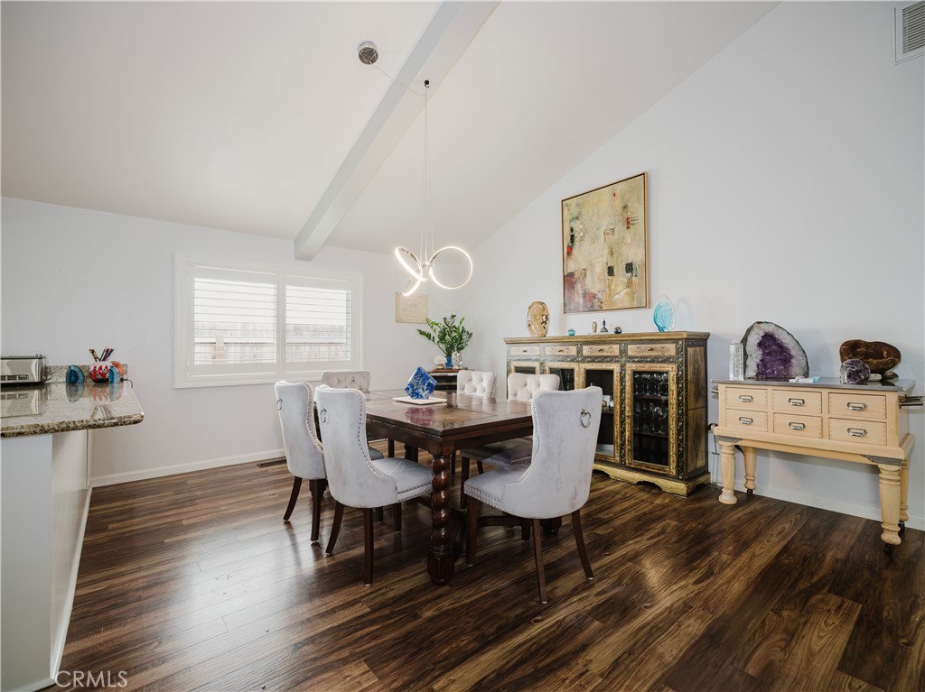 5330 Seabreeze Way Oxnard, CA 93035 - Photo 12 of 38 a view of a dining room with furniture and wooden floor