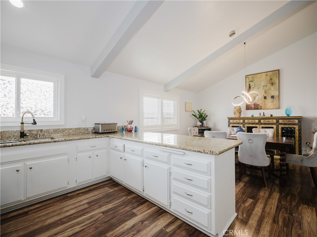 5330 Seabreeze Way Oxnard, CA 93035 - Photo 14 of 38 a kitchen with sink cabinets and chair