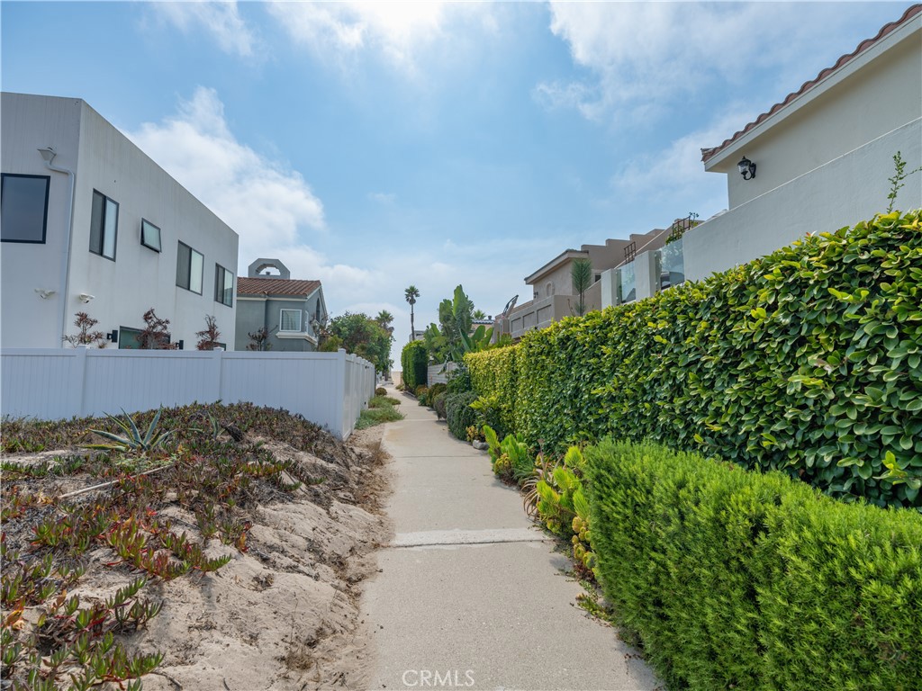 5330 Seabreeze Way Oxnard, CA 93035 - Photo 31 of 38 a view of a pathway both side of house