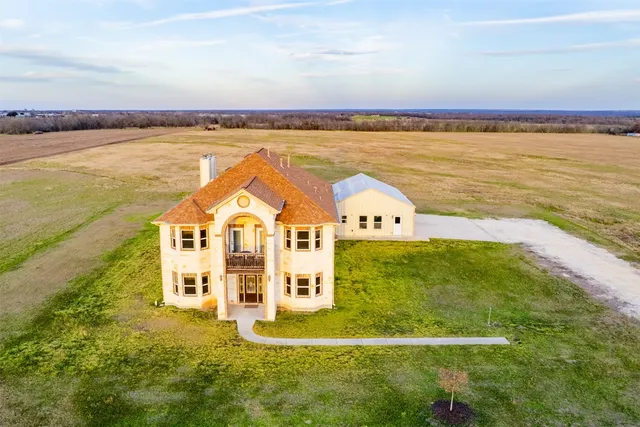 a view of a big room with an ocean view and beach