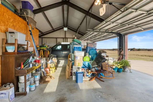 a view of a garage with a table and chairs