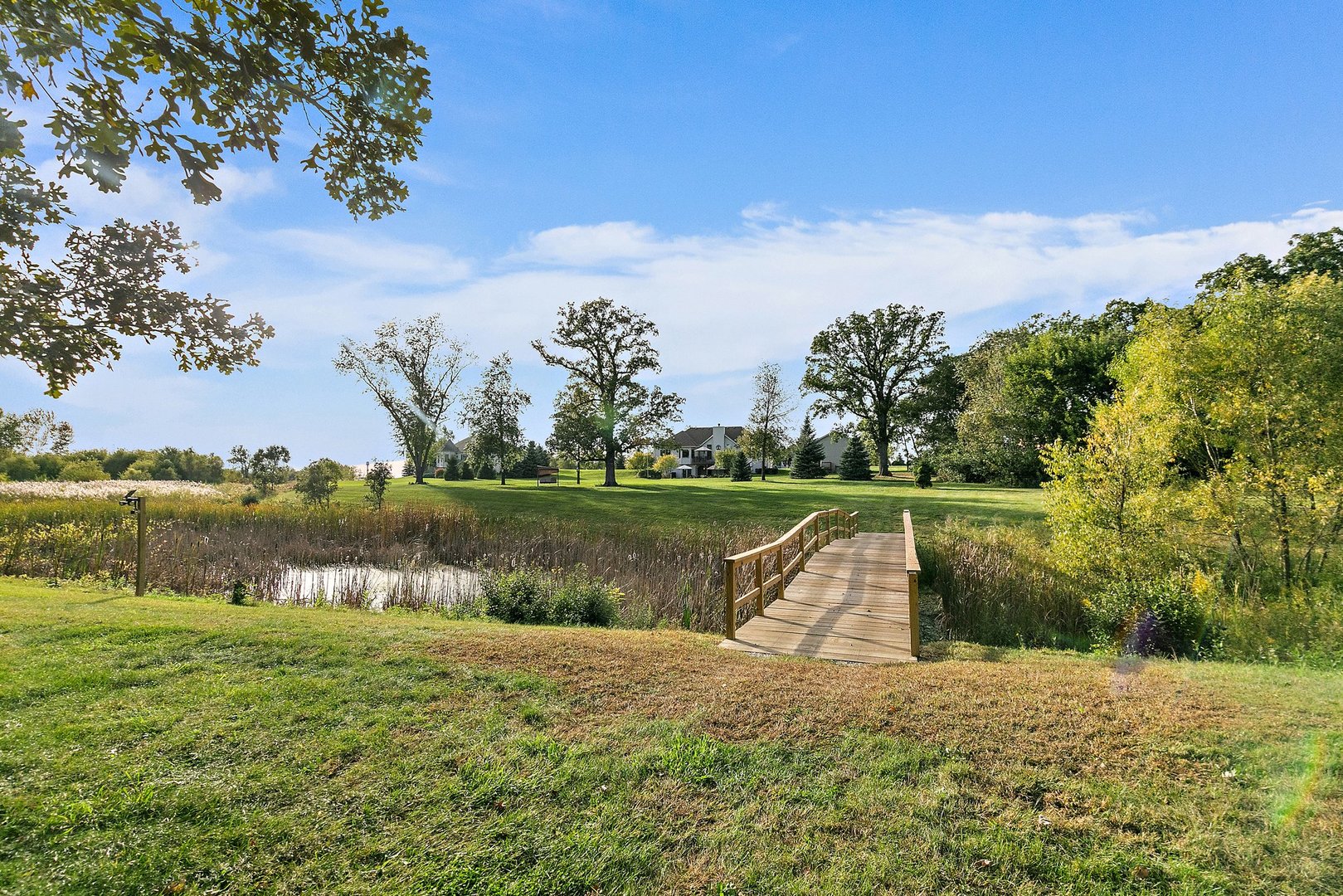 8908 South Hill Road Marengo, IL 60152 - Photo 13 of 53 a view of a lake with a yard and large trees