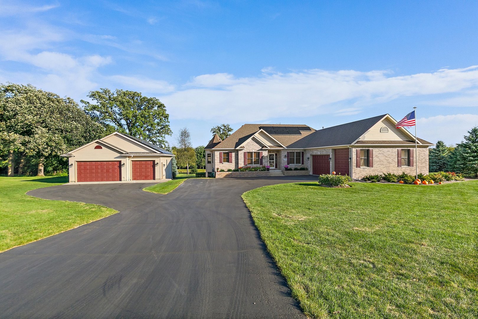 8908 South Hill Road Marengo, IL 60152 - Photo 2 of 53 a front view of a house with garden
