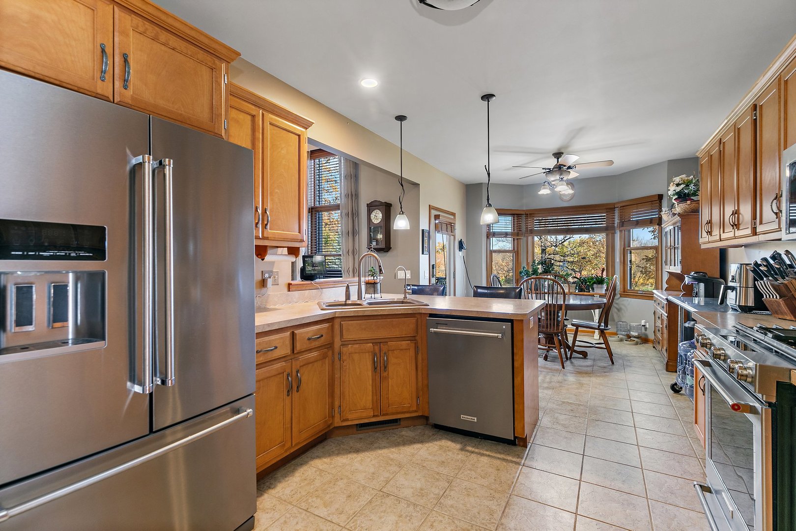 8908 South Hill Road Marengo, IL 60152 - Photo 38 of 53 a kitchen with stainless steel appliances granite countertop a refrigerator a sink dishwasher stove and oven