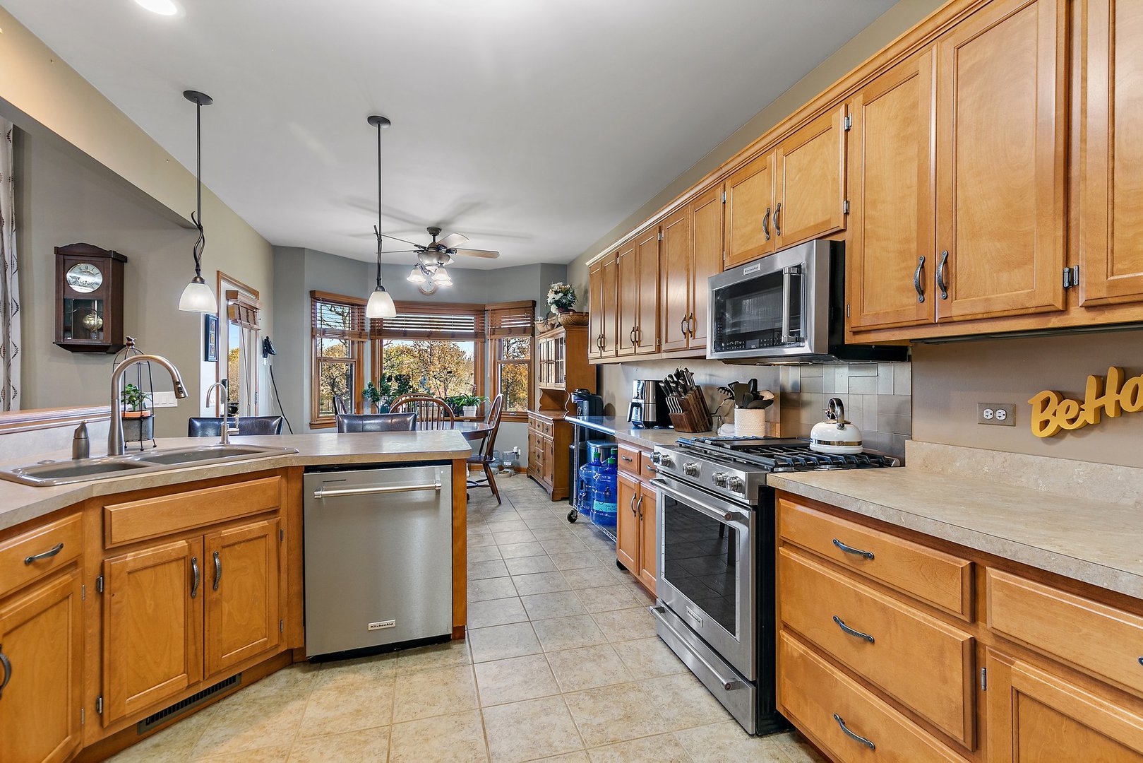 8908 South Hill Road Marengo, IL 60152 - Photo 39 of 53 a kitchen with stainless steel appliances granite countertop a sink and cabinets