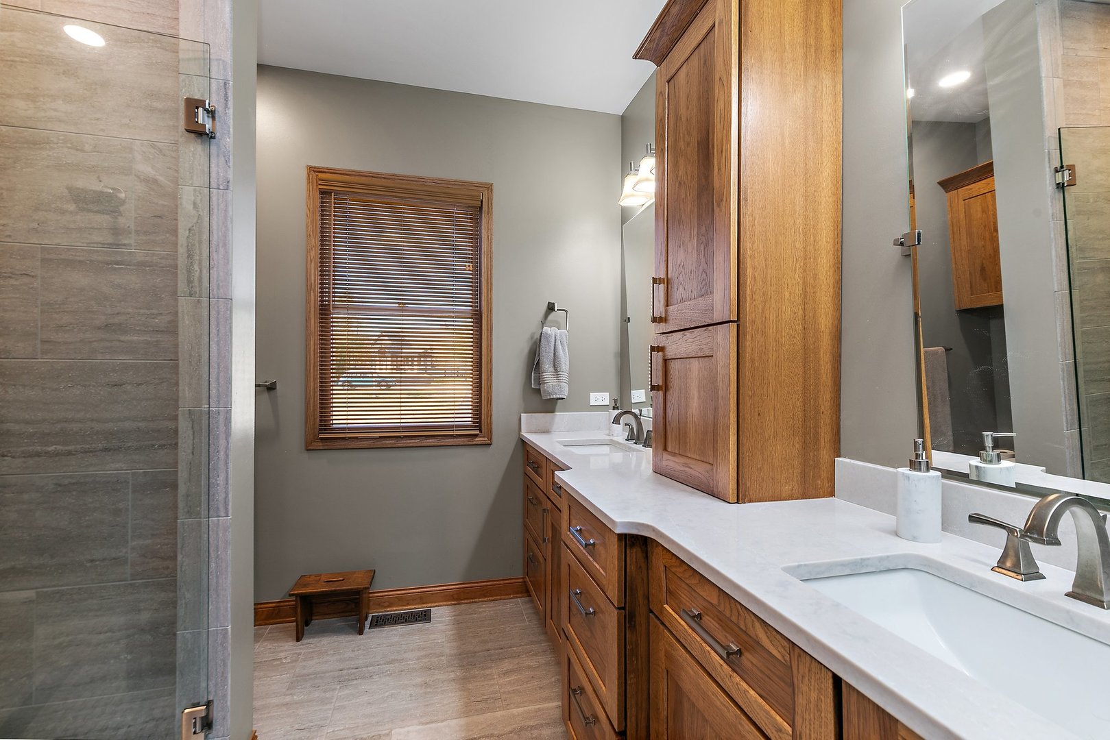 8908 South Hill Road Marengo, IL 60152 - Photo 44 of 53 a bathroom with a double vanity sink a mirror and a shower