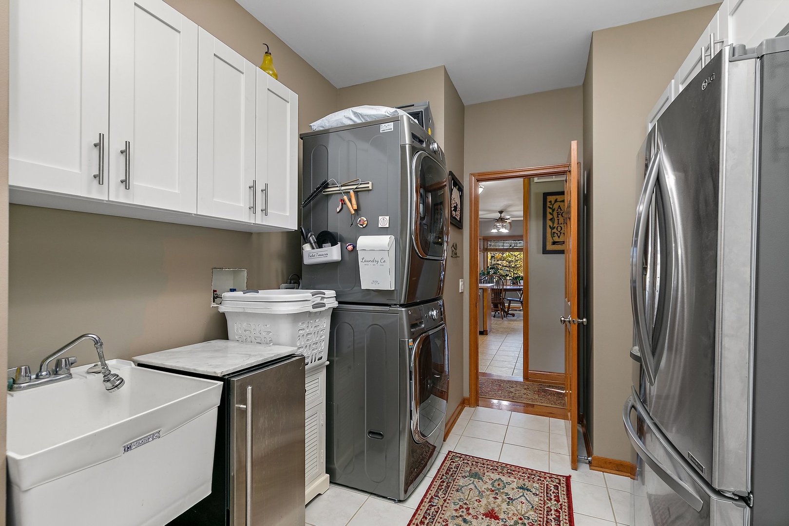 8908 South Hill Road Marengo, IL 60152 - Photo 51 of 53 a kitchen with a refrigerator sink and cabinets