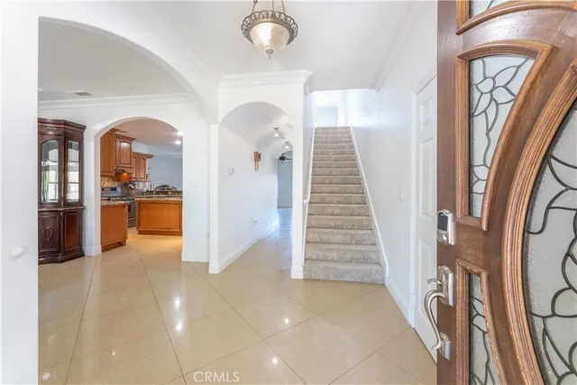 a view of a dining room with furniture and a kitchen