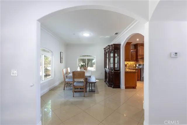 a kitchen with a stove sink and cabinets