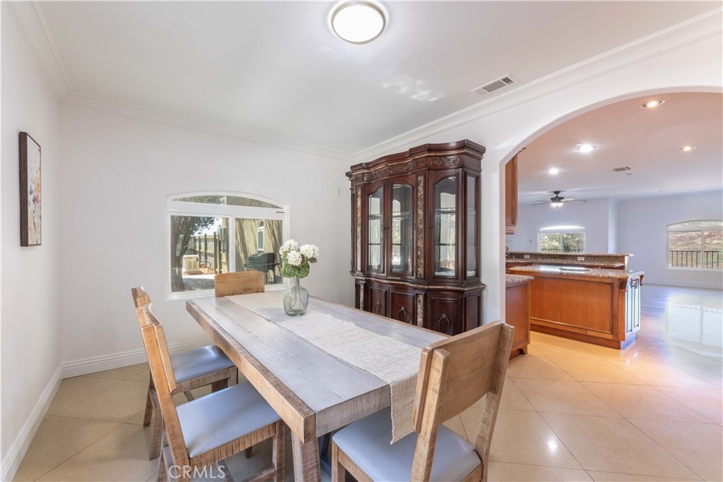 19075 Caesar Drive Ramona, CA 92065 - Photo 20 of 75 a view of a dining room with furniture and a kitchen