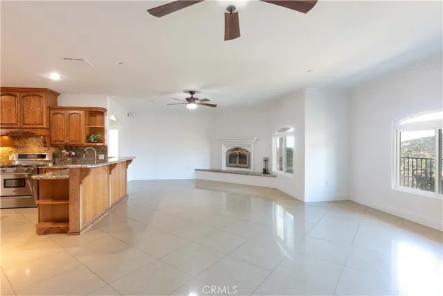 a bathroom with a granite countertop tub sink and mirror