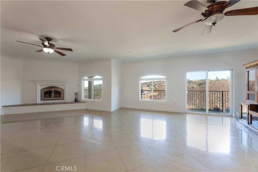 19075 Caesar Drive Ramona, CA 92065 - Photo 28 of 75 a view of an empty room with a fireplace and a window
