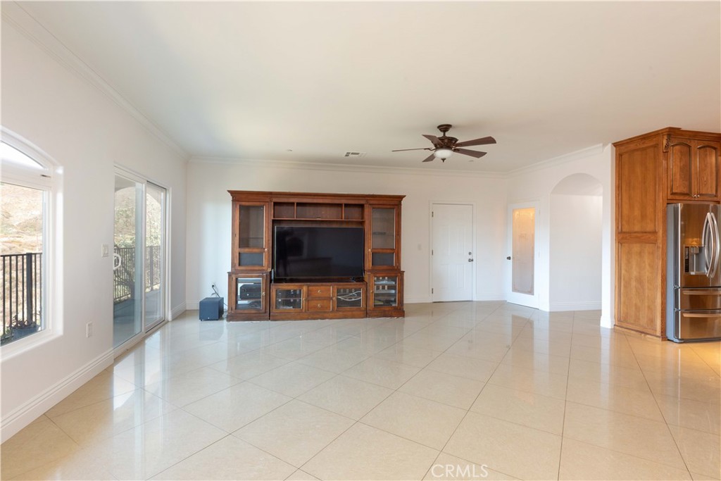 19075 Caesar Drive Ramona, CA 92065 - Photo 29 of 75 a view of a livingroom with a furniture a ceiling fan and window
