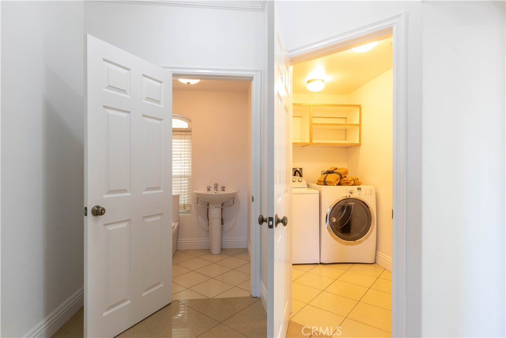 19075 Caesar Drive Ramona, CA 92065 - Photo 31 of 75 a bathroom with a sink and a washing machine
