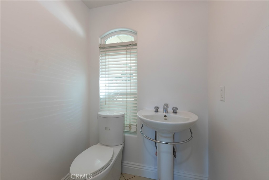 19075 Caesar Drive Ramona, CA 92065 - Photo 33 of 75 a bathroom with a sink a toilet and a mirror