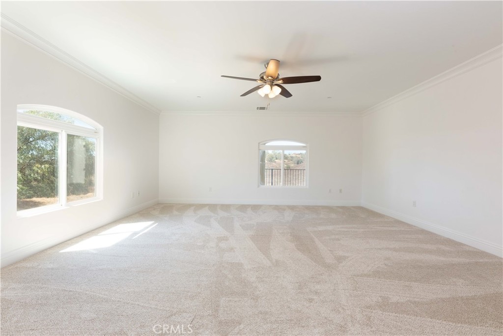 19075 Caesar Drive Ramona, CA 92065 - Photo 35 of 75 a view of a room with a empty space and a ceiling fan