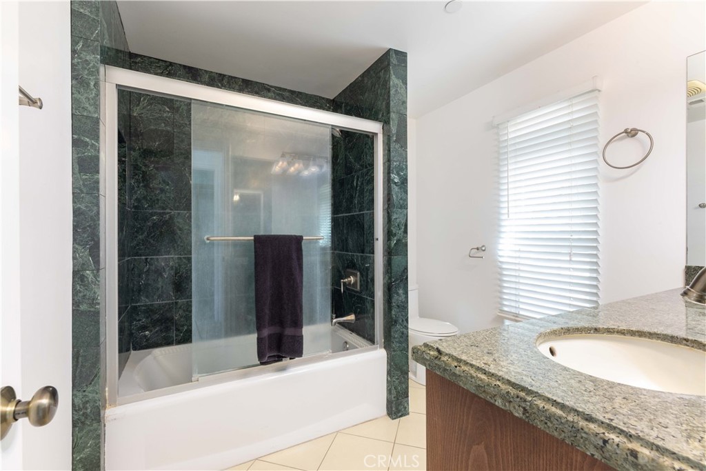 19075 Caesar Drive Ramona, CA 92065 - Photo 38 of 75 a bathroom with a granite countertop tub sink and mirror