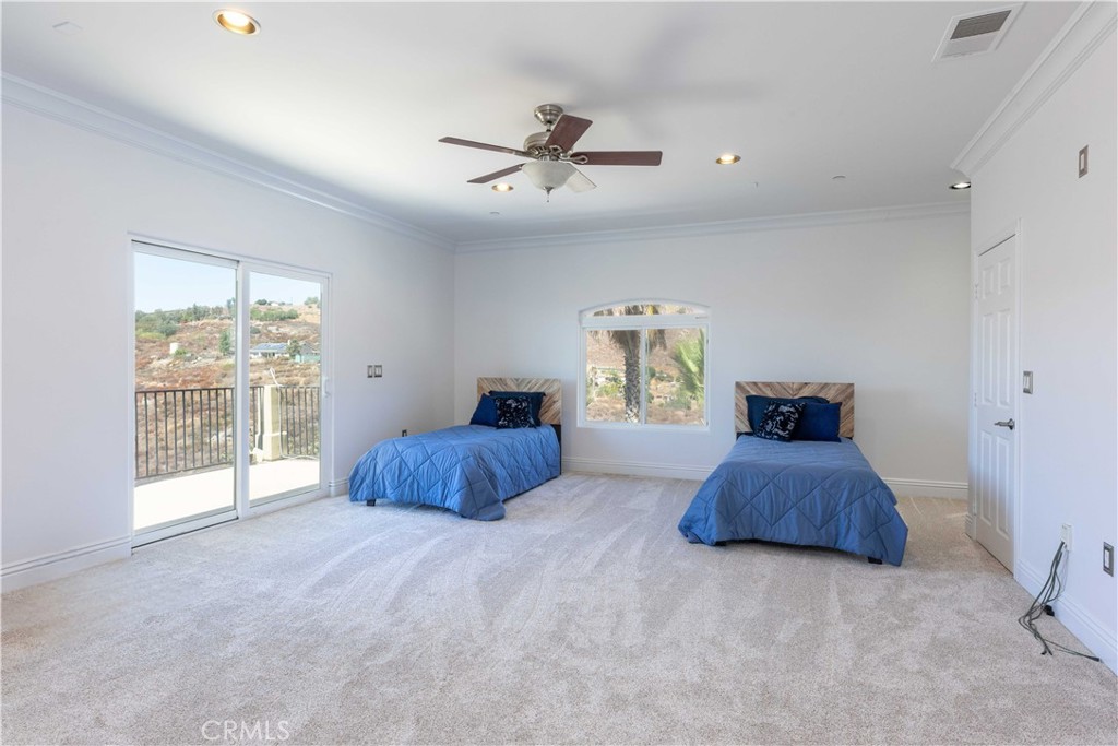 19075 Caesar Drive Ramona, CA 92065 - Photo 40 of 75 a bedroom with a bed and a window
