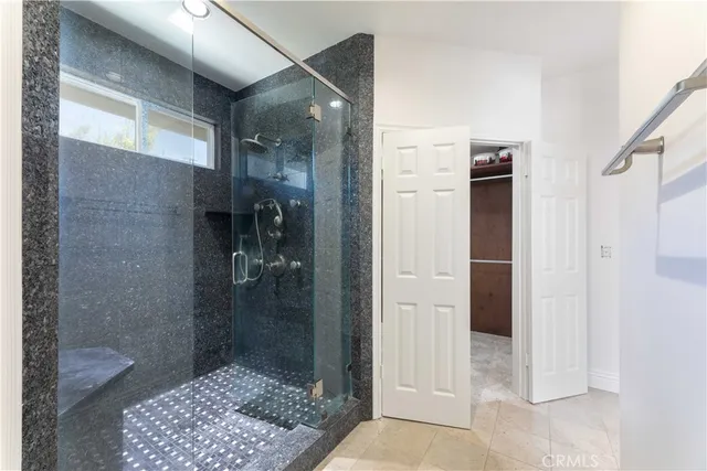 a view of a livingroom with a ceiling fan and window