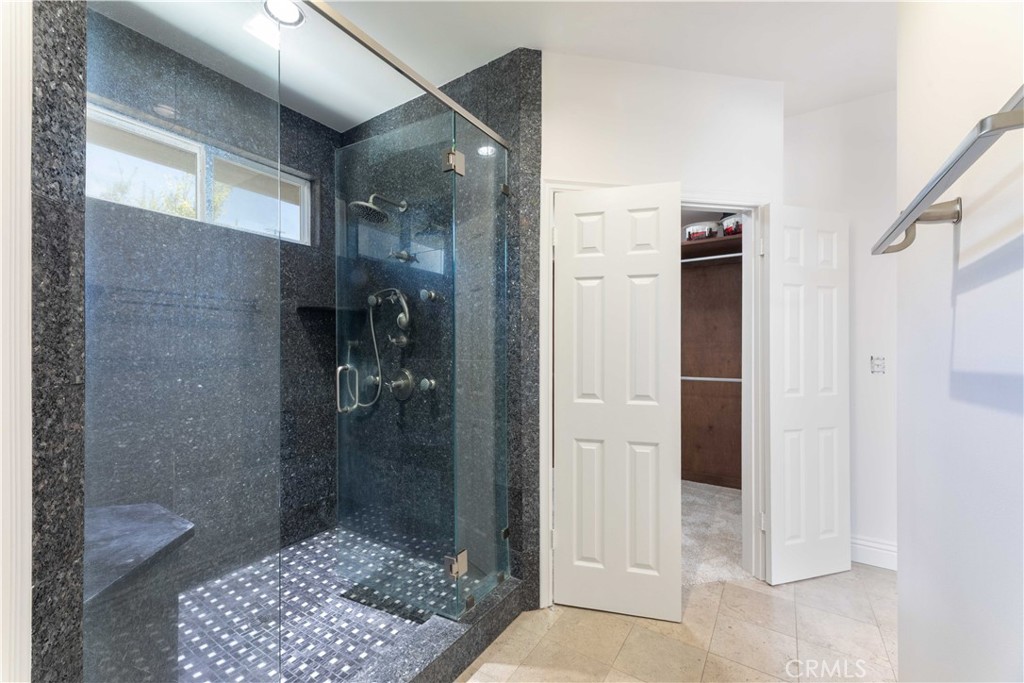 19075 Caesar Drive Ramona, CA 92065 - Photo 47 of 75 a bathroom with a glass door shower