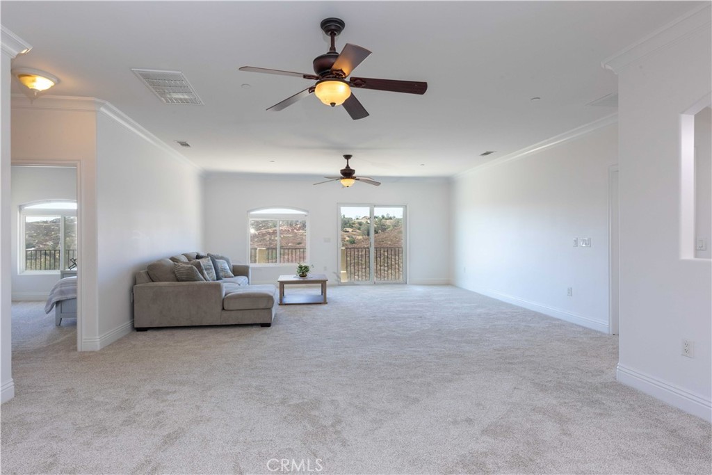 19075 Caesar Drive Ramona, CA 92065 - Photo 55 of 75 a living room with furniture and a chandelier