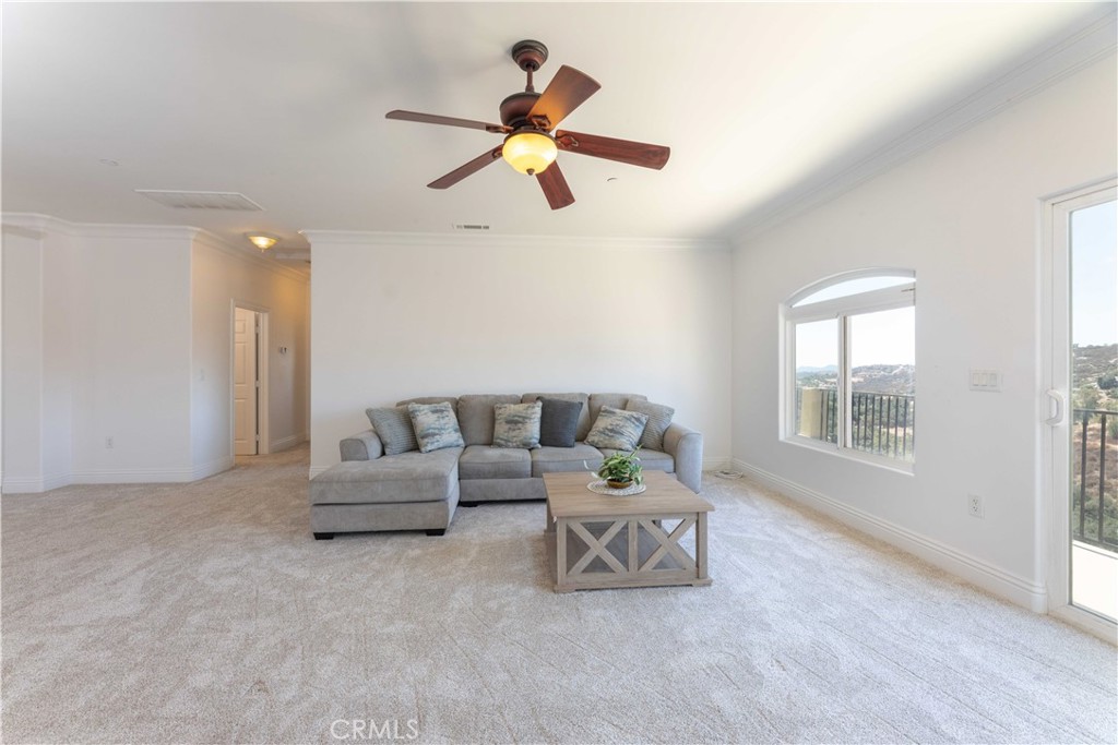 19075 Caesar Drive Ramona, CA 92065 - Photo 57 of 75 a living room with furniture and a ceiling fan