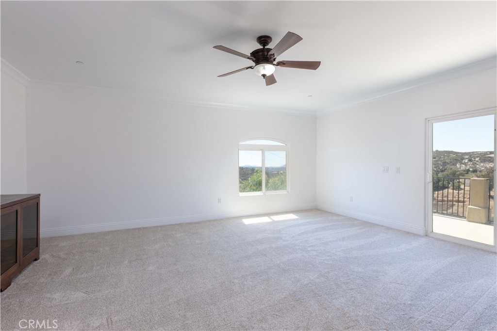 19075 Caesar Drive Ramona, CA 92065 - Photo 67 of 75 a view of a livingroom with a ceiling fan and window