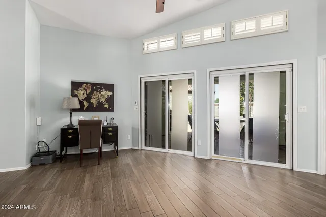 a view of a dining area with furniture wooden floor and chandelier