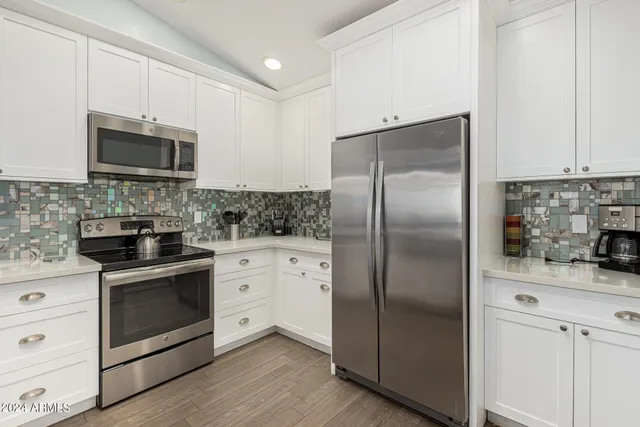 a bedroom with a bed couch and window