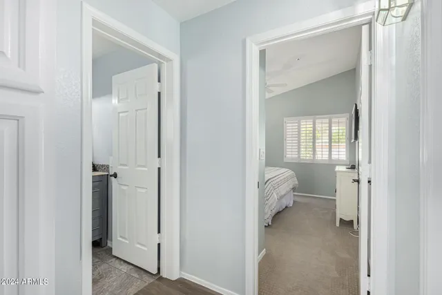 a bedroom with bed and a window