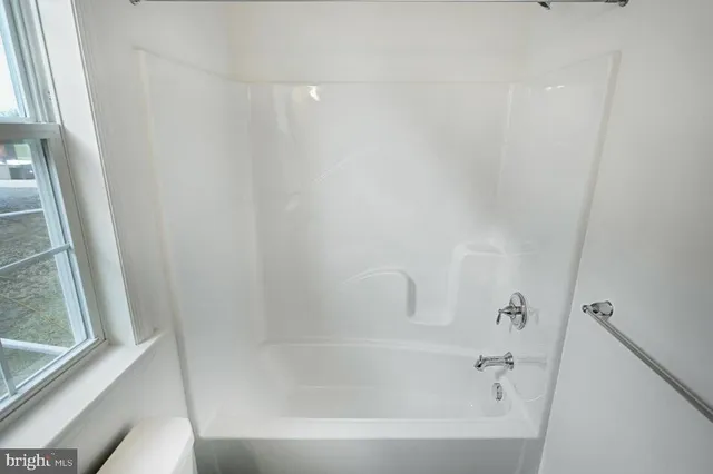 a close up of a bathtub curtain