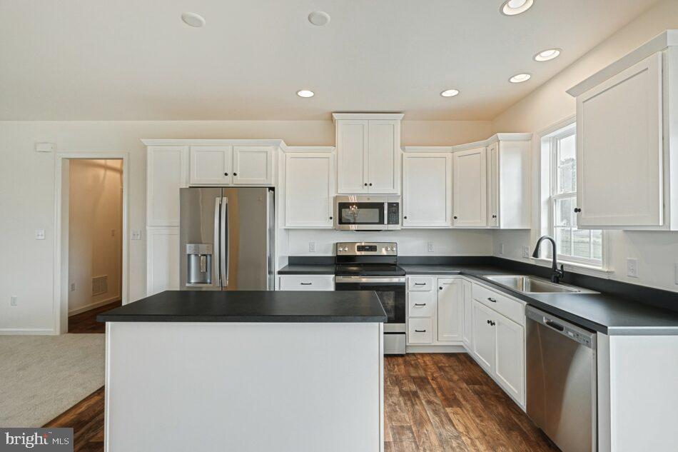 0 Old Orch Road, Unit CAMPBELL Strasburg, PA 17579 - Photo 6 of 14 a kitchen with stainless steel appliances granite countertop a refrigerator a stove a sink and white cabinets