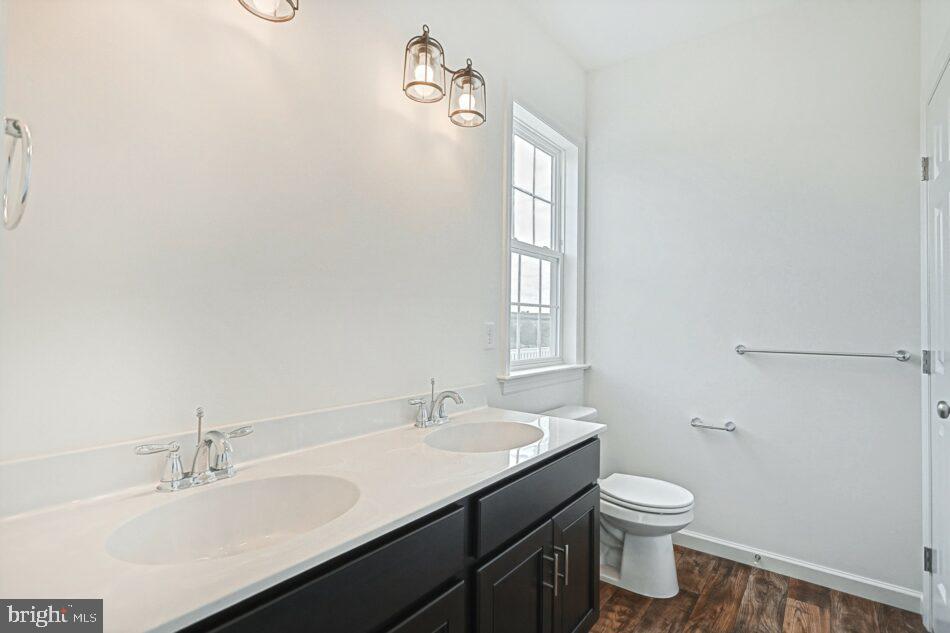 0 Old Orch Road, Unit CAMPBELL Strasburg, PA 17579 - Photo 8 of 14 a bathroom with a sink toilet and vanity
