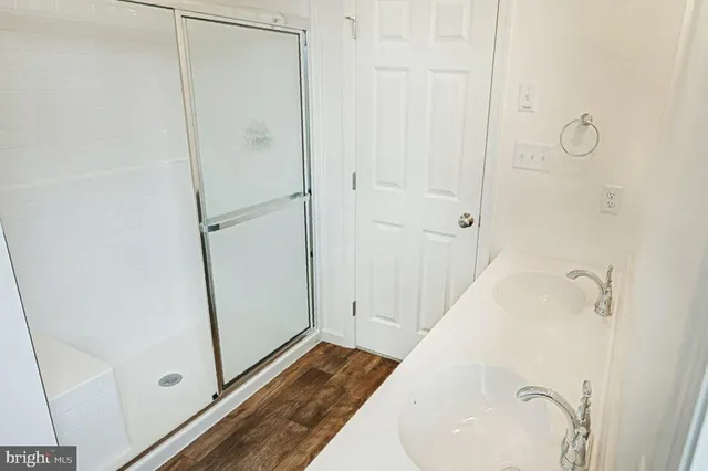 a bathroom with a tub and a shower