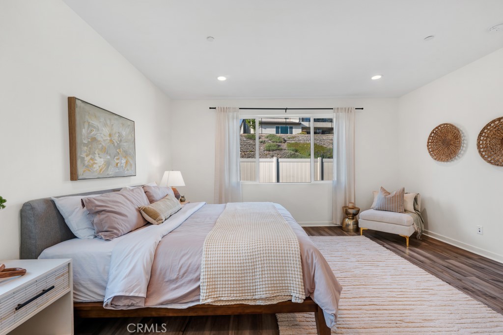 28536 Daybreak Way Saugus, CA 91350 - Photo 12 of 32 a bedroom with a bed and wooden floor