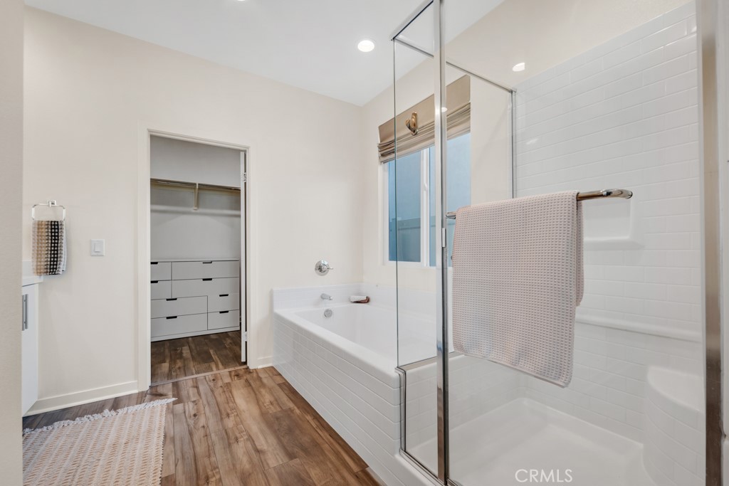 28536 Daybreak Way Saugus, CA 91350 - Photo 13 of 32 a bathroom with a bathtub and a shower