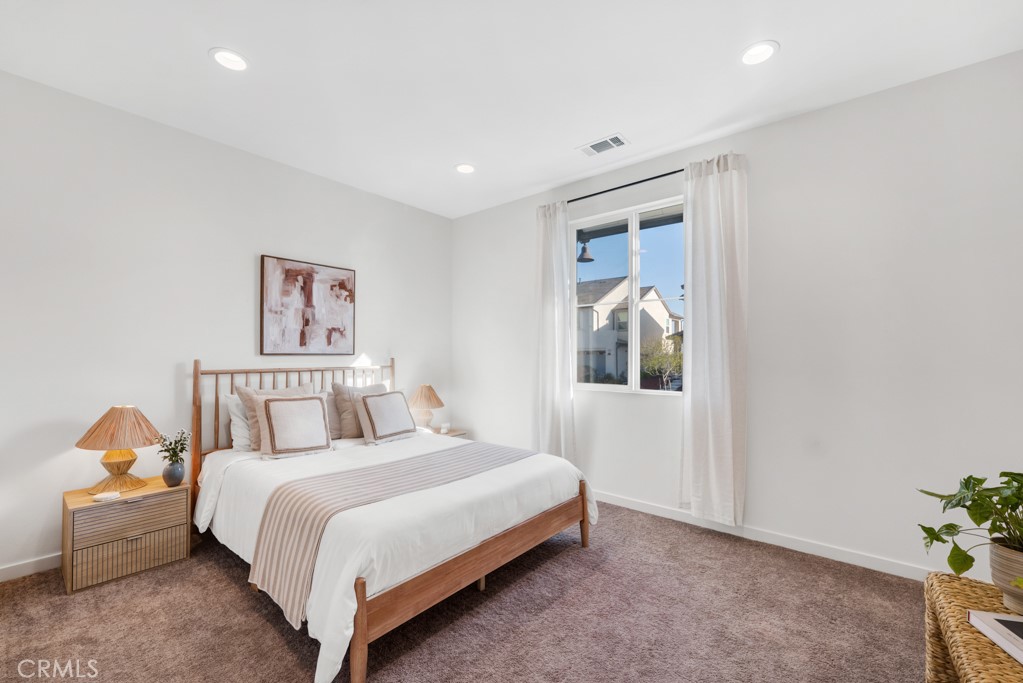 28536 Daybreak Way Saugus, CA 91350 - Photo 15 of 32 a bedroom with a bed and a painting on the wall