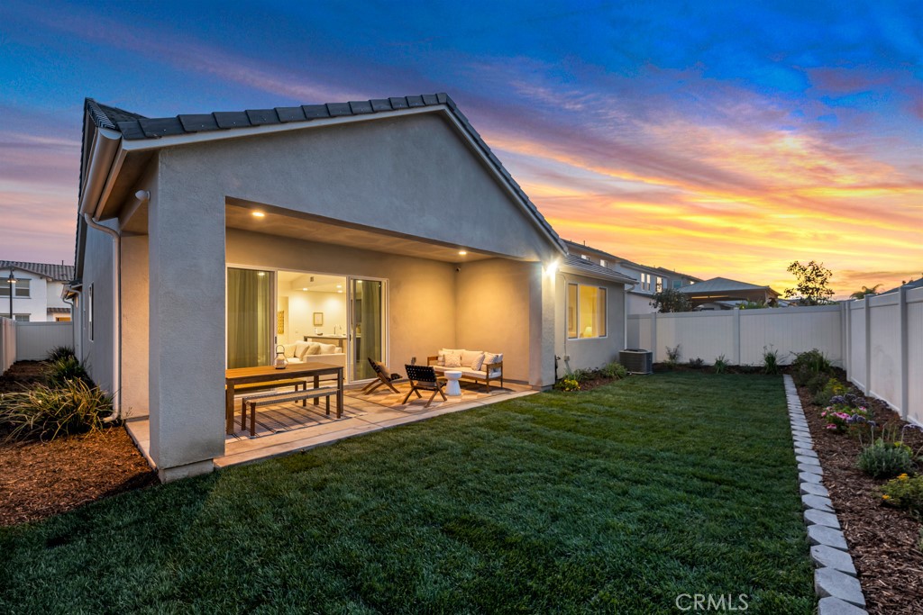 28536 Daybreak Way Saugus, CA 91350 - Photo 2 of 32 a backyard of a house with table and chairs