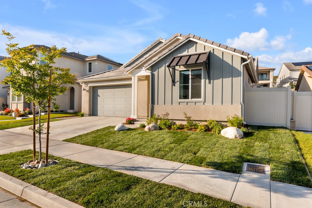 28536 Daybreak Way Saugus, CA 91350 - Photo 22 of 32 a front view of a house with garden