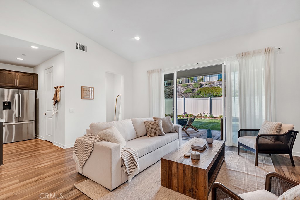 28536 Daybreak Way Saugus, CA 91350 - Photo 8 of 32 a living room with furniture and a wooden floor