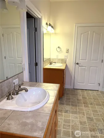 a bathroom with a bathtub and shower